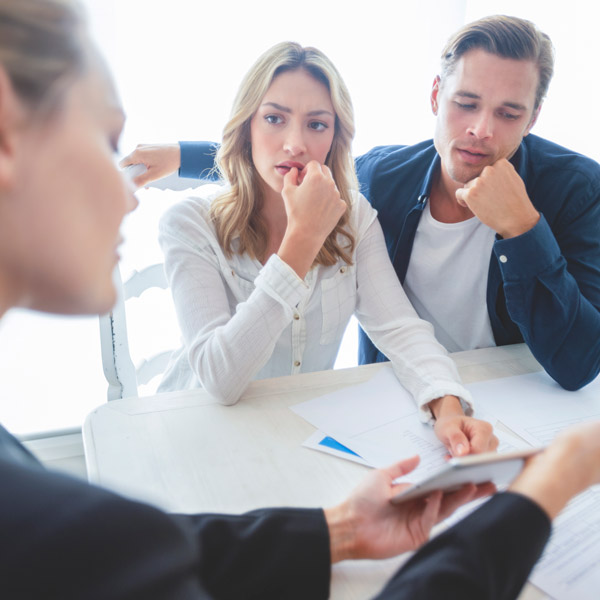 couple talking to female lawyer